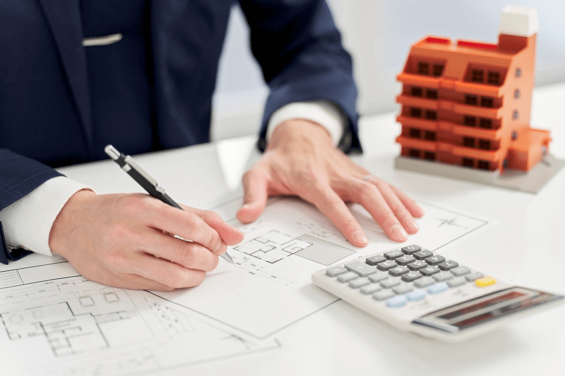 Real estate investor reviewing renovation plans using the BRRRR method strategy.